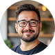 Smiling man with glasses casual professional profile portrait